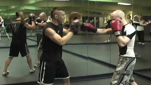 Boxing Basics: How to Do the 1,2,1,2 Focus Mitt Drill with Cover and Countering