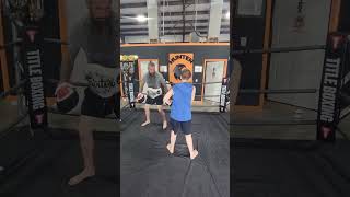 Working in some knees and elbows in his Muay Thai lesson.
