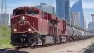 CP freight train with awesome rumbling CP ES44AC locos at front leaving Calgary on the Laggan sub.