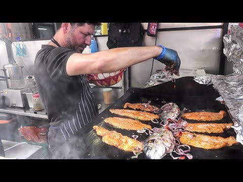 Cooking Lot of Fish on Grill. Mediterranean Street Food, London