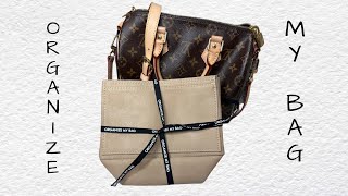 Update:I'm starting to love my speedy 25 without the organizer. Ive  complained so much about the structure of it without embracing the fact  that its a slouchy-ish bag. She's pretty without the