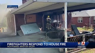 Winston-Salem firefighters on scene of vacant house fire with heavy flames, smoke