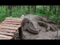 Sculpting a HUGE mud Lizard and jumping it on a bike!