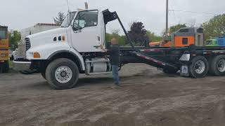 stock  1268.  2005 Settling roll off. 25 1/2 foot rails.  380k kms. MB4000 and Eaton 15 speed.