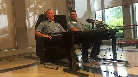 Police Officers Help Injured Marathon Runner