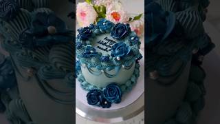 Vanilla cake adorned with blue buttercream floral decorations.💙🩵💙 #cakedecorating #vanillacake #cake