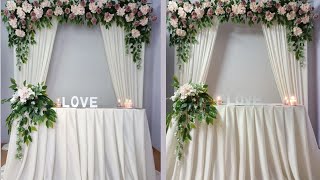 Natural and romantic wedding backdrop / wedding ceremony arch and sweetheart table.