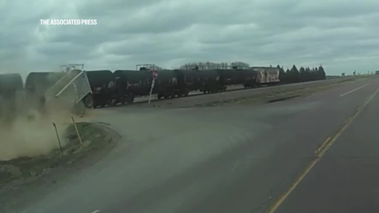 Video captures freight train crashing through grain truck in rural ...