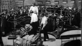 Tying up bags for train, U.S. Post Office