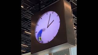 Schiphol Airport’s Creepiest Clock – Is There a Man Trapped Inside This Clock?