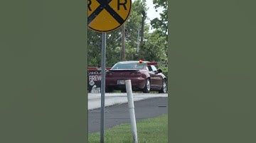 Car runs gate without stopping in front of fast-moving CSX Y101