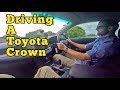 Driving a Toyota Crown on Maraetai Cost Road, New Zealand