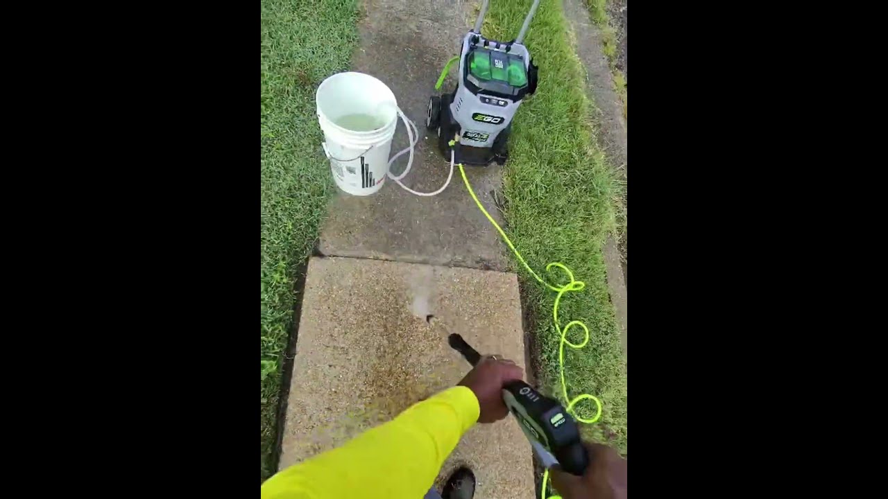 Pressure Washing the sidewalk.  