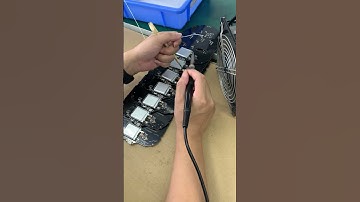 Using solder, secure the battery to the base plate of the luminous mask #factory #led #flash