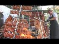 Tons of Cuban Meat Roasted on Pyramidal Grills. Street Food Festival in Italy