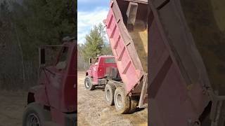 GMC Detroit Diesel Dump Truck Dumping Load