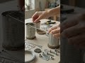 Hands building recycled metal br…
