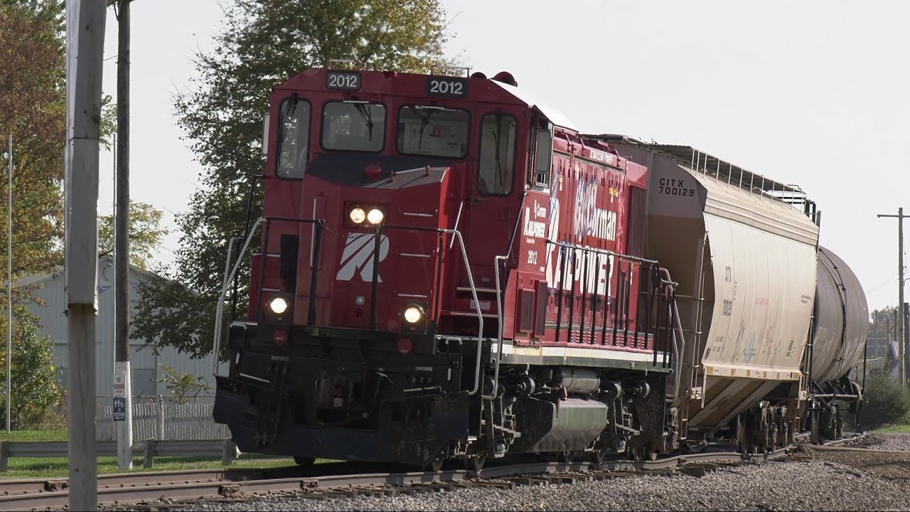 Cars roll by without engine Tagged up RJ Corman Railpower genset on bad track Wooster Ohio RJC 2012