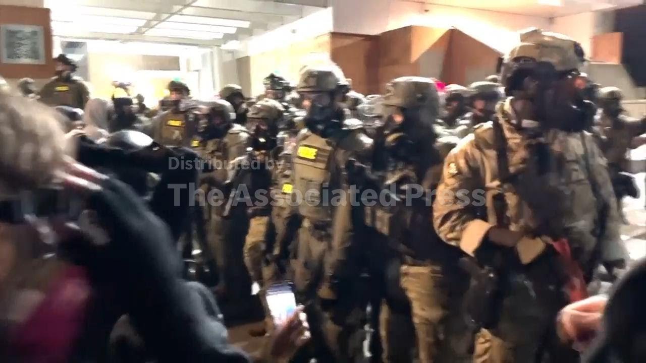 Authorities confront protesters outside of Portland ICE facility