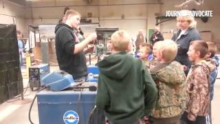 Peetz FFA member Brian Roselle shows an arc welder to elementary students as part of an Ag in the Cl