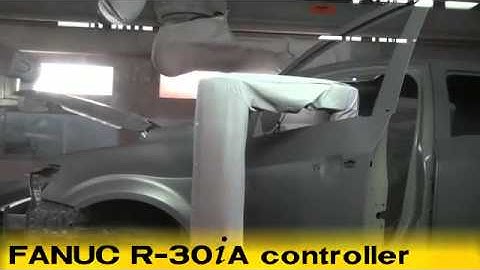FANUC P 500iA and P 700iA robots prime paint and seal a car body