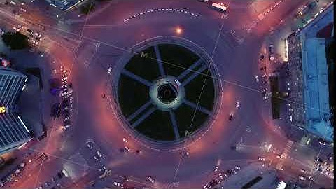 Hyperlapse timelapse of night city traffic. Drone spin over the intersection. Beautiful night