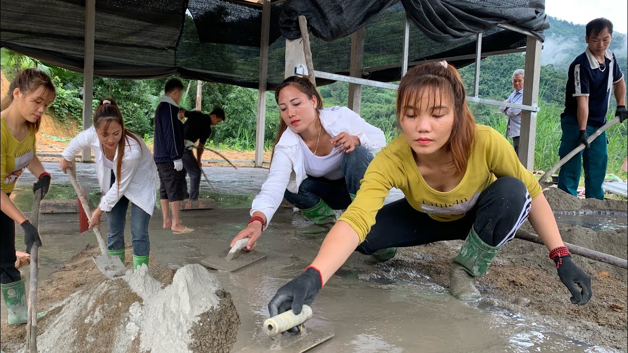 Her shop has a solid concrete floor thanks to the builders.