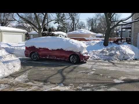 lexus is250 in snow drift.