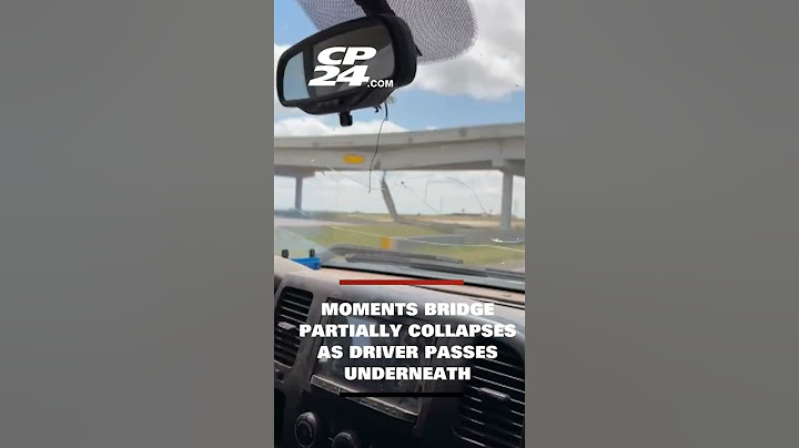 Shocking video shows moment bridge partially collapses as driver passes underneath