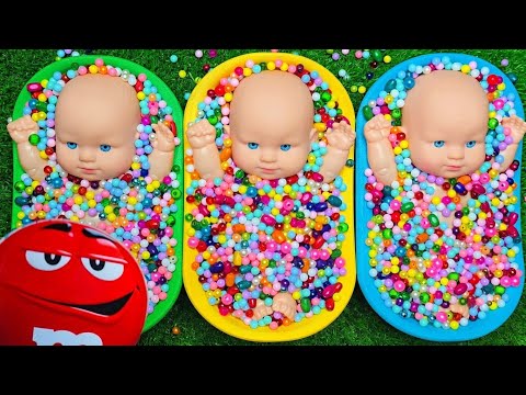 Baby Dolls Playing in Bright Colorful Tubs
