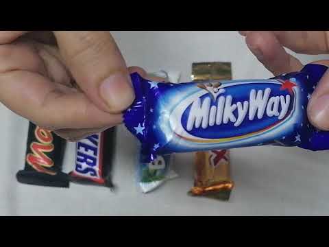 Unwrapping chocolate minis: Mars,  Snickers, Bounty, Twix, MilkyWay