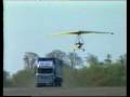 flexwing microlight lands  on truck