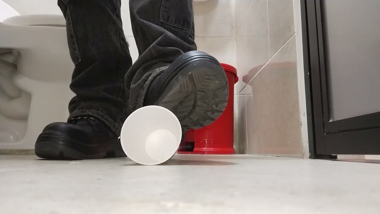 Work boots crushing a plastic cup 