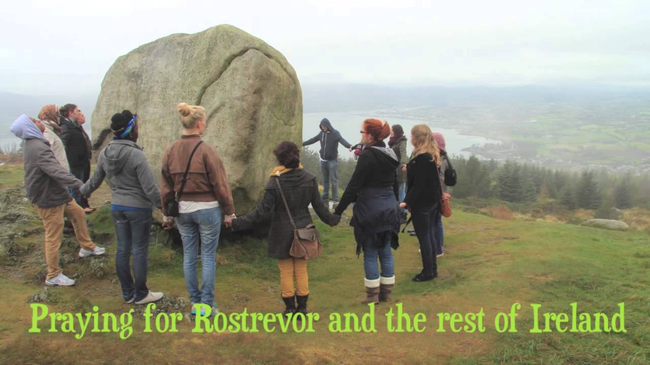 YWAM Ireland staff and outreach team praying on the top of Mourne Mountains, Rostrevor