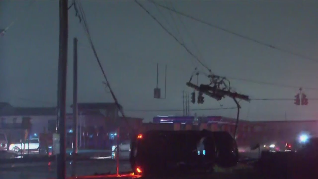 Car flips and takes down power lines on W. Henrietta Road - YouTube