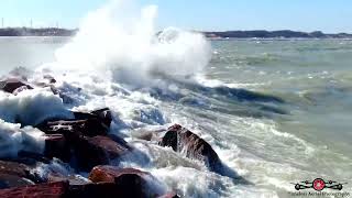 Flying over Michigan City break wall with MT. Baldy in the background 4K Drone Footage