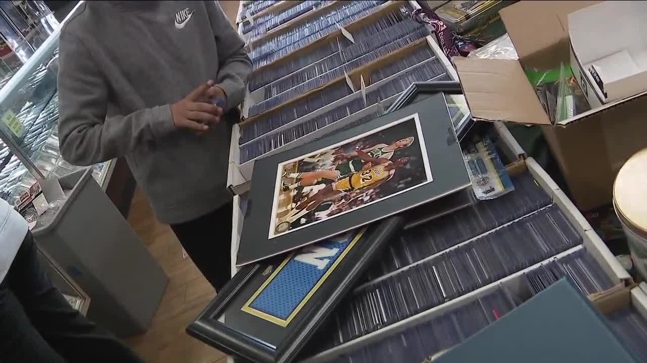 Sports card store owner surprises boy who lost card collection in Denver house fire YouTube