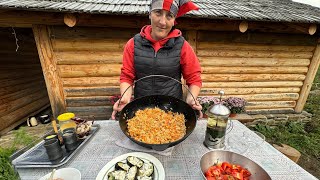 Highlanders prepare dinner in the village in the fresh air high in the mountains of Ukraine!