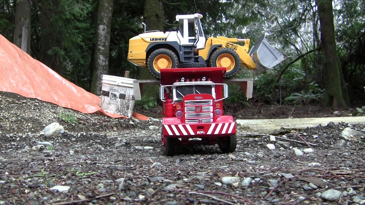 RC Dump Truck hauling a Wheel Loader back to the shop