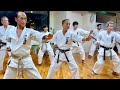 A karate dojo where many people in their 80s and 70s are practicing diligently.