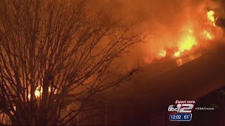 Video: Man tosses baby to firefighters from burning apartment balcony