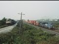 Two trains racing side by side as they make a dash for the ny state line 92098