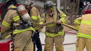 Springfield fire fighters put a hose line up after a house fire