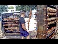 Huge Skewers with Pig Legs on Big Grills. Italy Street Food