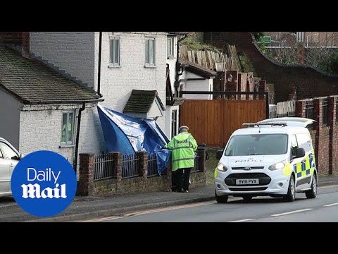 Police tape off roads and probe garden where body was found - Daily