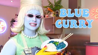 Juno cooks blue curry