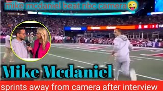 Miami dolphin Coach mike mcdaniel after interview\/Mike Mcdaniel runs away from cameraman at halftime