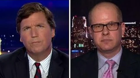 Tucker vs critic who calls him cheerleader for Rus...