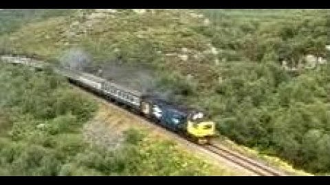 Passenger Train Near Plockton Kyle Railway Line On History Visit To Highlands Of Scotland