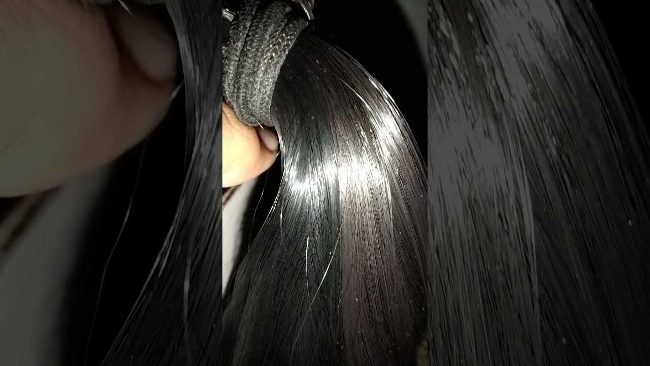 Long hair silky and shiny Pony tail play by man at night